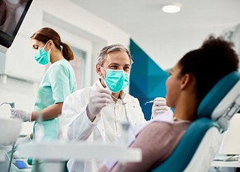 Dentist treats patient