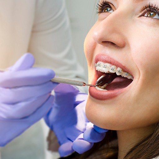 Woman in dentist’s chair undergoing dental checkup